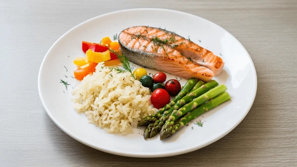 Colorful balanced plate with vegetables, grains, and protein arranged in harmonious portions